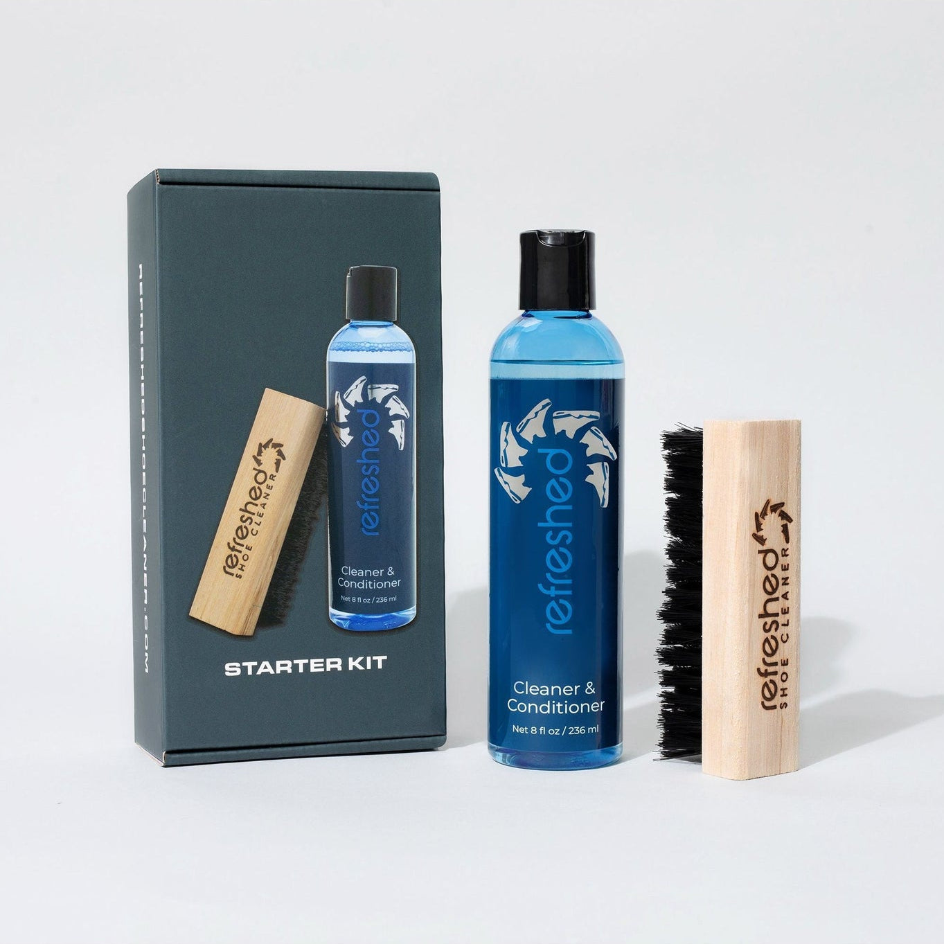 Fellather Starter Kit with two blue bottles, a brush, and a box on a white background