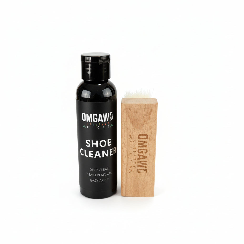 OMGAWO shoe cleaning brush and bottle on a wooden surface